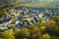 View from above of apartment residential condos between yellow fall trees in suburban area in South Carolina. American Royalty Free Stock Photo