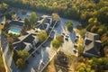 View from above of apartment residential condos between yellow fall trees in suburban area in South Carolina. American Royalty Free Stock Photo