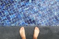 View From Above on Bare Male feet at Swimming Pool Side