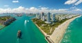 View from above of big container ship entering main channel in Miami harbor near South Beach high luxurious hotels and Royalty Free Stock Photo