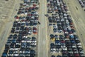 View from above of big parking lot with parked used cars after accident ready for sale. Auction reseller company selling