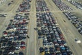 View from above of big parking lot with parked used cars after accident ready for sale. Auction reseller company selling