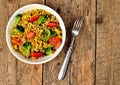 View from above of bowl with tuna risotto with vegetables, tomatoes, broccoli and parsley Royalty Free Stock Photo
