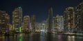 View from above of brightly illuminated high skyscraper buildings in downtown district of Miami Brickell in Florida, USA