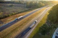 View from above of busy american highway with fast moving trucks and cars. Interstate transportation concept