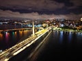 the view from above of the city at night of a large bridge