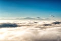 View above the clouds with in the distance the popocatepetl volcano, Mexico Royalty Free Stock Photo