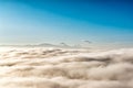Above the clouds with in the distance the popocatepetl volcano, Mexico Royalty Free Stock Photo