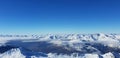 view above clouds in valley of snowy mountain in european Alps Royalty Free Stock Photo