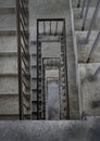 View from above of concrete spiral staircases pattern of square shape are in the old building architecture Royalty Free Stock Photo