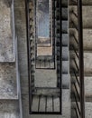 View from above of concrete spiral staircases pattern of square shape are in the old building architecture Royalty Free Stock Photo