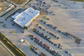 View from above of dealers outdoor parking lot with many brand new cars in stock for sale. Concept of development of Royalty Free Stock Photo