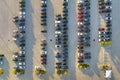 View from above of dealers outdoor parking lot with many brand new cars in stock for sale. Concept of development of Royalty Free Stock Photo