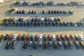 View from above of dealers outdoor parking lot with many brand new cars in stock for sale. Concept of development of Royalty Free Stock Photo