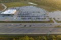 View from above of dealers outdoor parking lot with many brand new cars in stock for sale on highway side. Concept of Royalty Free Stock Photo