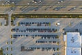 View from above of dealers outdoor parking lot with many brand new cars in stock for sale on highway side. Concept of Royalty Free Stock Photo