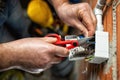 Electrician at work on a residential electrical system. Electricity Royalty Free Stock Photo