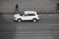 View from above of fast moving shiny white car on the road. speeding in the city concept. volkswagen Tiguan vehicle on city road. Royalty Free Stock Photo