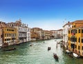 View from above on the Grand Canal, floating gondolas and boats with tourists, Venice