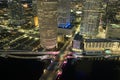 View from above of illuminated skyscraper buildings, pedestrian riverwalk and street traffic in downtown of Tampa city Royalty Free Stock Photo