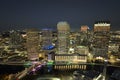 View from above of illuminated skyscraper buildings, pedestrian riverwalk and street traffic in downtown of Tampa city Royalty Free Stock Photo