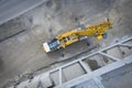 View from above on large heavy truck crane in front of concrete scaffolding Royalty Free Stock Photo