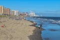 View from above a long beach at low tide from Ventnor City to Atlantic City showing large casino buildings in the distance