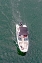 View from above on a motor boat with passengers sailing across t