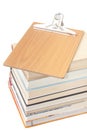 View from above on a pile of books with wooden message board Royalty Free Stock Photo
