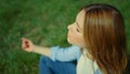 View from above of pretty girl sitting in yoga asana. Closeup girl in meditation