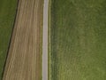 View from above of a rural asphalt road between cornfi elds in summer Royalty Free Stock Photo