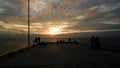 View Above The Sea Pier With The Evening Sky And Fishing Silhouettes Royalty Free Stock Photo