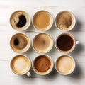 The view from above of several cups of coffee of various varieties being served.