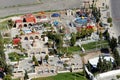 View from above of a small amusement park with play equipment for children on the edge of Karak, Jordan