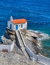 A small white church on the  beach, Andros, Cyclades, Greece Royalty Free Stock Photo