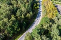 View from above on a smooth bend of the road going through the forest area Royalty Free Stock Photo