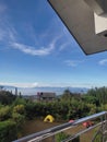 the view from above with the soaring sky, mountains and trees and three tents Royalty Free Stock Photo