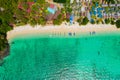 View from above, stunning aerial view of a beautiful tropical beach with white sand and turquoise clear water, long-tail boat and Royalty Free Stock Photo