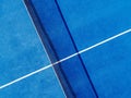 Overhead drone view of a blue paddle tennis court