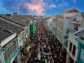 View from above Tallang Rd Sunday night market in old phuket town Thailand. Busy with people amongst the old historical houses