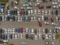 A view from above to the lines of parked cars. Heavy traffic in the parking lot. Searching for spaces in the busy car park. Royalty Free Stock Photo