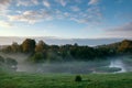 View from above to the small rural river at sunrise Royalty Free Stock Photo