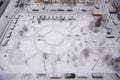 View from above to the yard of residential building after snowfall with snow covered cars Royalty Free Stock Photo