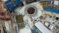 View from above, top down aerial view of a construction site with cranes in Kuala Lumpur, Malaysia