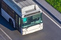 View from above on a white passenger city bus, a cabin and a drivers windshield on a highway Royalty Free Stock Photo