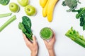 View from above woman's hands holding bunch spinach