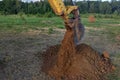 View from above at Working Excavator Tractor Digging A Trench. Royalty Free Stock Photo