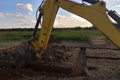 View from above at Working Excavator Tractor Digging A Trench. Royalty Free Stock Photo