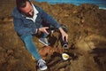 View from above of a young man drinking tea in the nature.