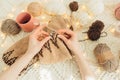 View from above of woman`s hands knitting warm beige sweater. Home, freelance, handmade mood concept Royalty Free Stock Photo